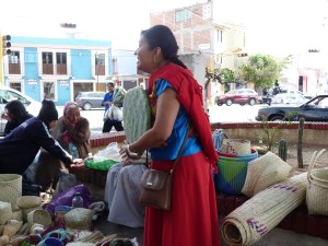 Nora outside of the market, with a large cactus pad