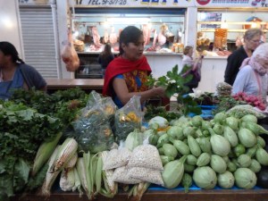 Nora peels the squash stems